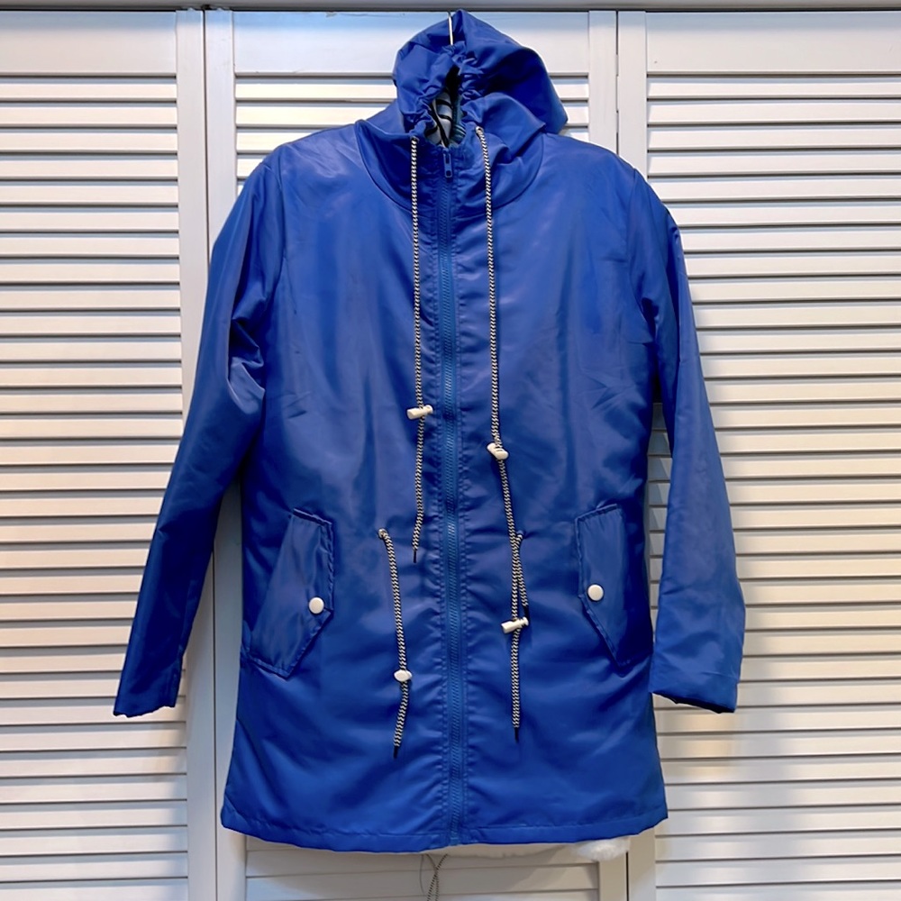 Rain jacket - blue.  Never worn.  Size M runs SMALL.  Drawstring waist and hood